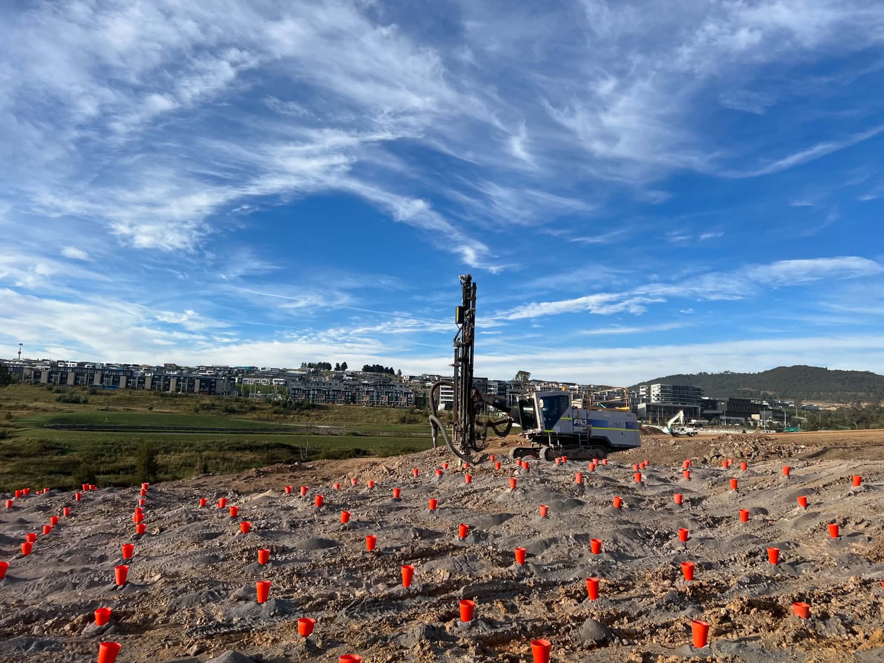 Drill pattern marked out beside a housing estate on a civil project